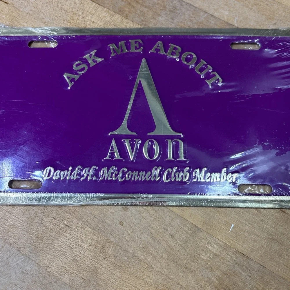 Vintage Avon Metal License Plate Purple Gold Advertising Sign NOS